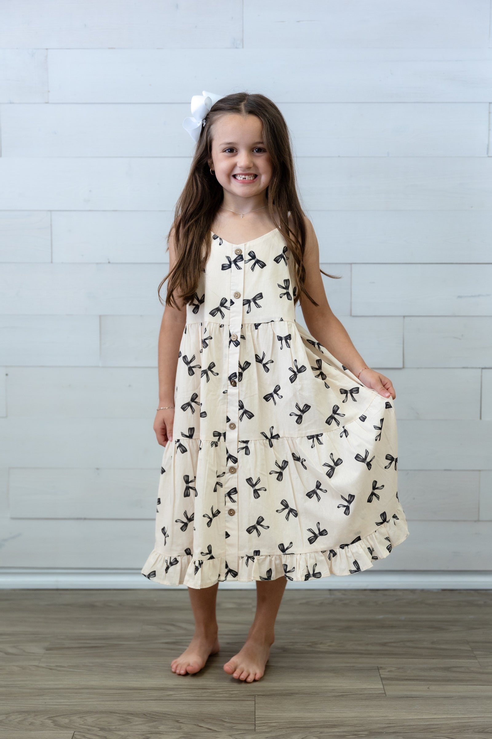 Girls Ivory Dress with Black Bows