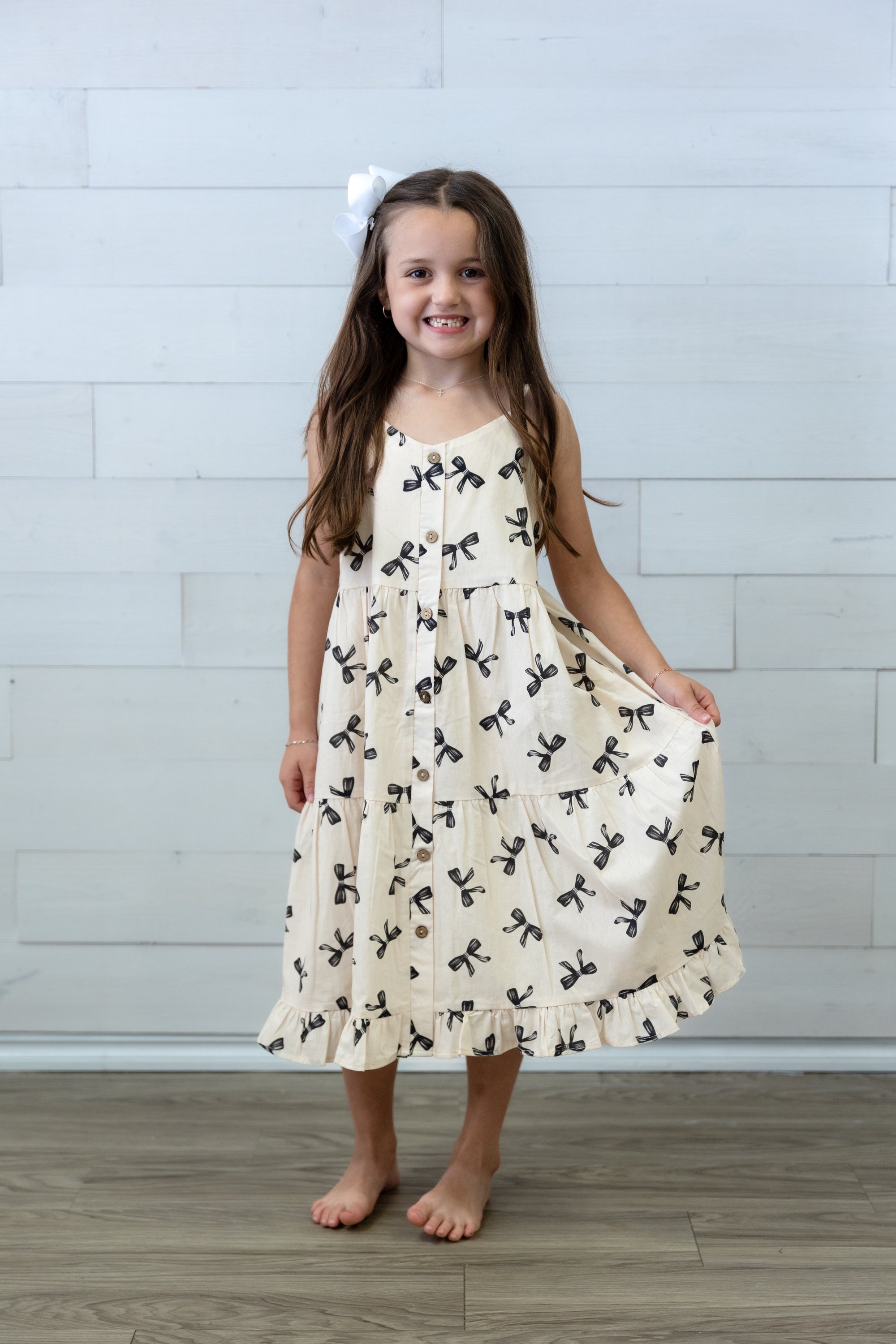 Girls Ivory Dress with Black Bows