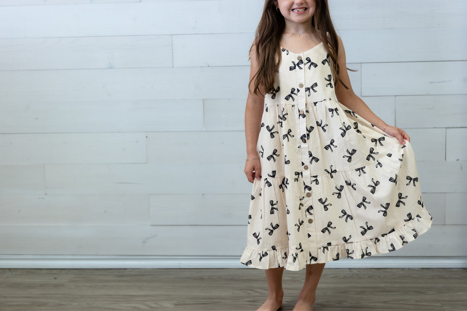 Girls Ivory Dress with Black Bows