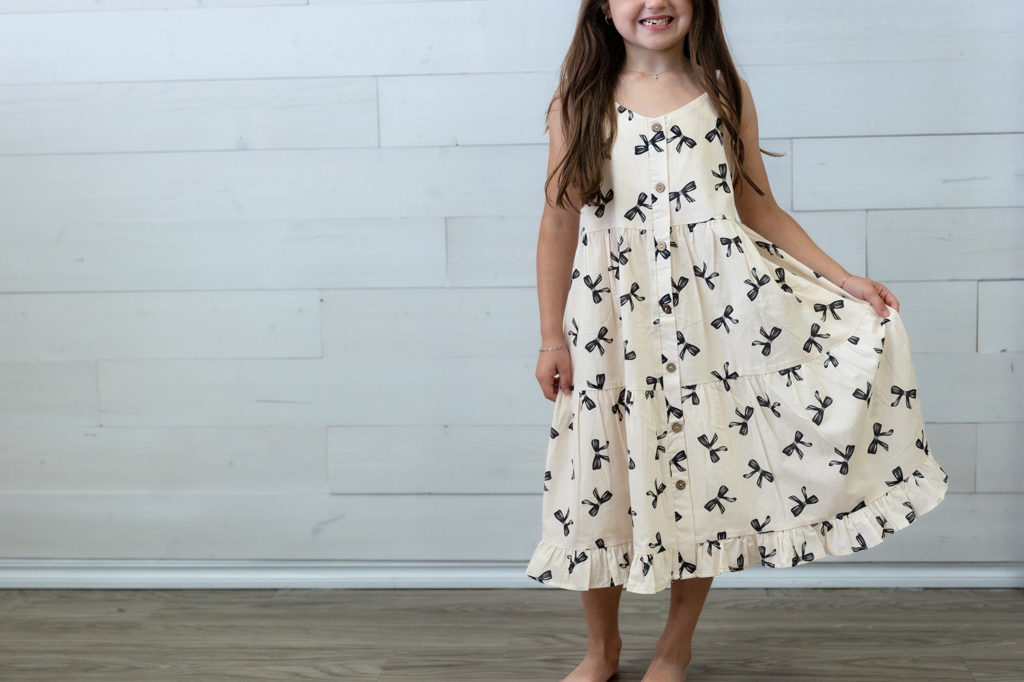 Girls Ivory Dress with Black Bows
