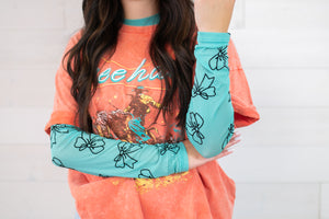 Merigold Kiss 3D Bow Turquoise Mesh LS Top